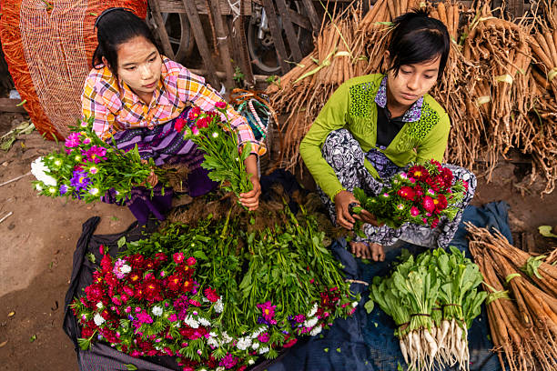 istock Burmese women selling flowers, Myanmar 2216019511