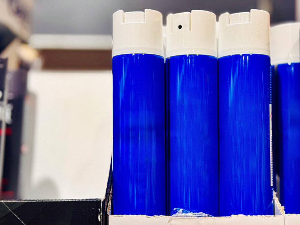 Blue Aerosol Cans on Retail Shelf
