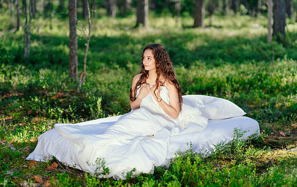 istock Girl wakes up in a summer forest 2216020766