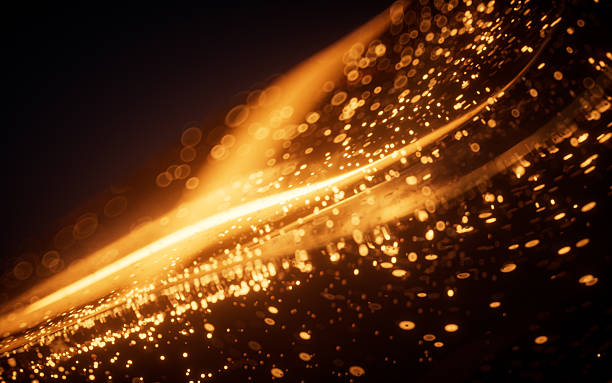 istock Golden glowing particles in glass geometry, 3d rendering. 2216022174