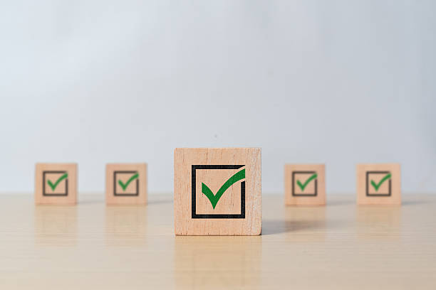 istock Wooden blocks with a green check mark representing completed tasks and positive evaluation. Suitable for business scheduling, progress tracking, and customer satisfaction visuals. 2216024762