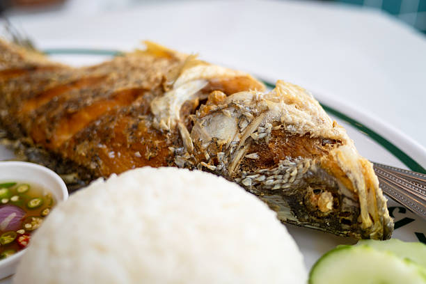 istock Crispy fried fish dish coastal restaurant food vibrant setting close-up angle 2216025326