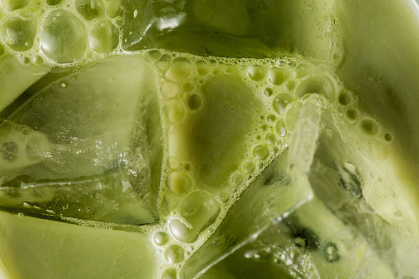 istock Refreshing Green Beverage with Ice Cubes and Bubbles Close-Up 2216025826