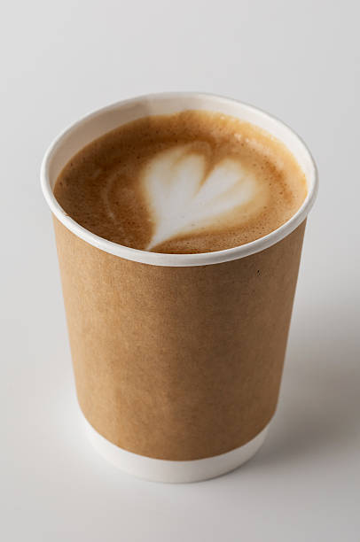 istock Heart Latte Art in Brown Paper Coffee Cup on White Surface 2216025874