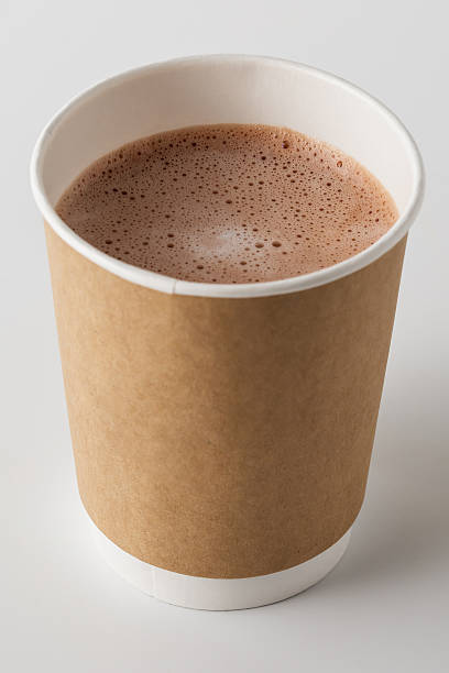 Steaming Hot Cocoa in Paper Cup with Brown Sleeve on White Background