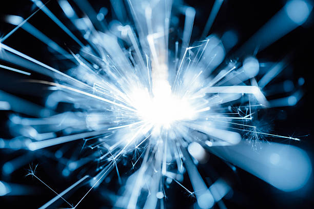 istock Bright Abstract Explosion of Light and Energy with Radiating Sparkles and Rays 2216025943