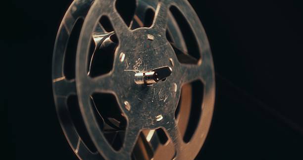 istock Macro view of a vintage 16mm reel in motion on an analog editing table backstage. 2216027471