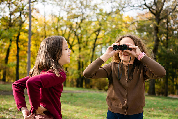 istock Children observe birds in nature with binoculars 2216027639