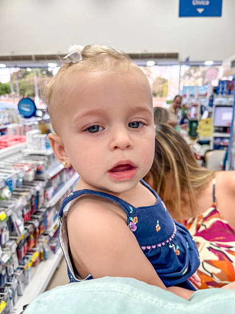 istock One year old baby girl in buggy 2216028233