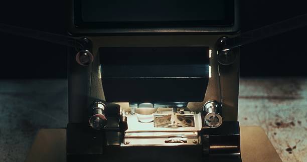 istock Light shines across an analog 16mm editing table during backstage film work. 2216028988