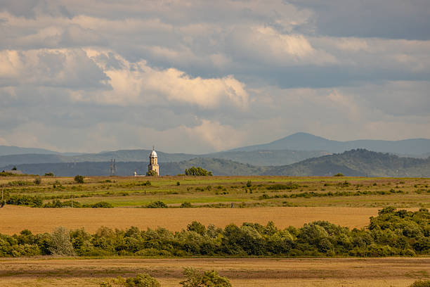 Landscape of spring plain with rural church