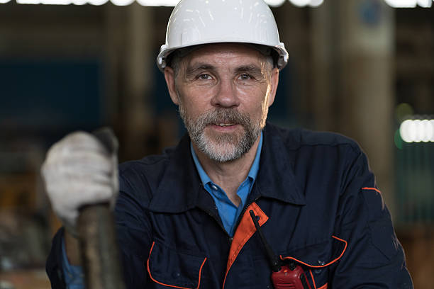 istock Worker, engineer, factory or storage warehouse. Senior engineer working in industry factory, inspection of machine for manufacturing, maintain, repair in industry warehouse 2216033090