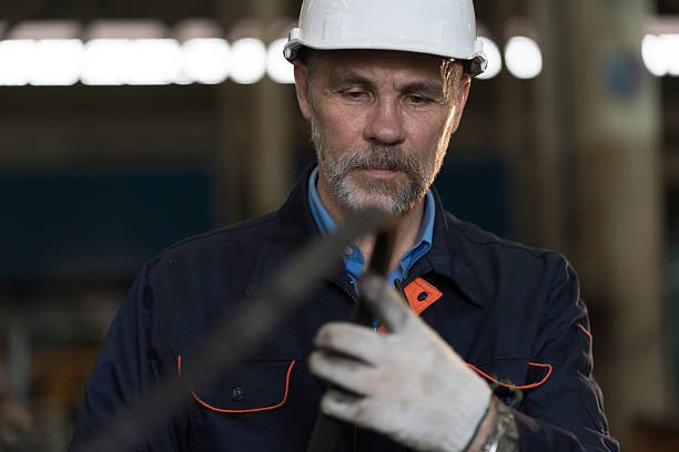 istock Worker, engineer, factory or storage warehouse. Senior engineer working in industry factory, inspection of machine for manufacturing, maintain, repair in industry warehouse 2216033092