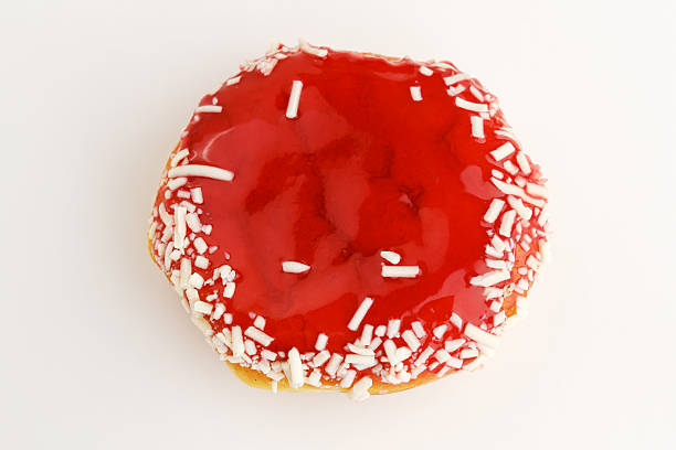 Strawberry Jam Donut with grated cheese on a white background