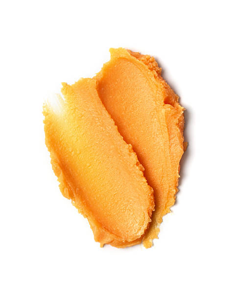 istock Closeup texture of raw orange shea butter 2216037384