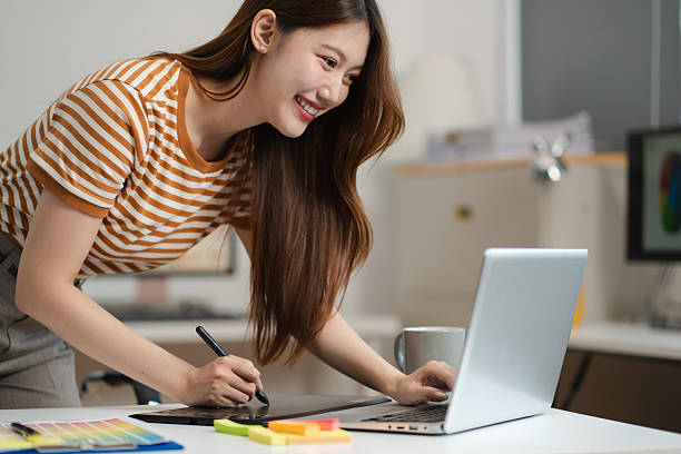 istock Designer woman thinking ideas strategy about mobile app interface wireframe design with customer breif and color code, User experience concept. 2216037692
