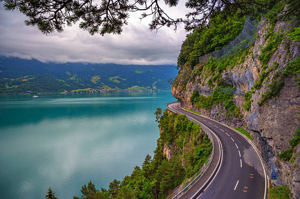 istock Winding Cliffside Road Over Lake Thun, Switzerland 2216050047
