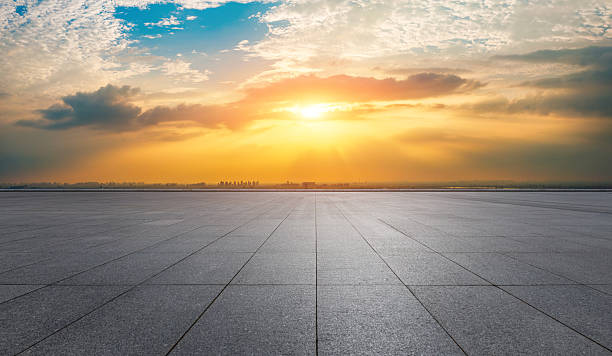 istock Empty square floor and city skyline with beautiful sky clouds at sunset 2216050182