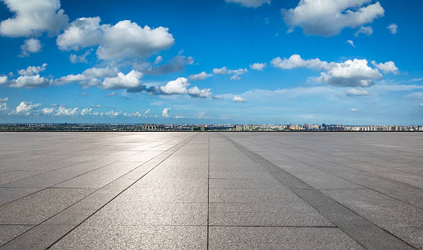 istock Empty square floor and city skyline with modern buildings under blue sky 2216050214