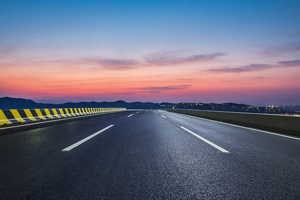 istock Empty asphalt highway road and mountain with beautiful sky clouds at dusk 2216050240