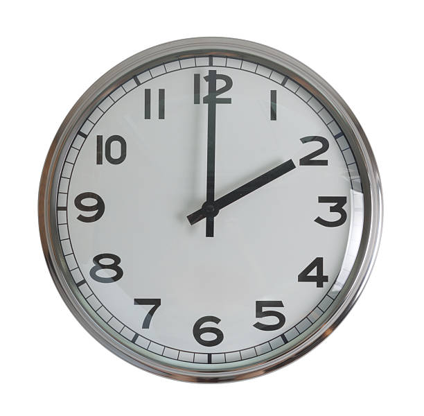 istock Wall hanging analog clock with white face and black number in classic vintage design which clock arm at 2 o'clock. Background isolated cutout in white background. 2216051763