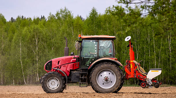 istock Tractor drilling seeding crops at farm field. Agricultural activity. Tractor spraying pesticides at soy bean fields. 2216052302
