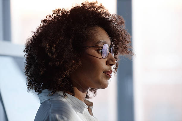istock Black Female Speaker Giving Presentation at Business Conference 2216054662