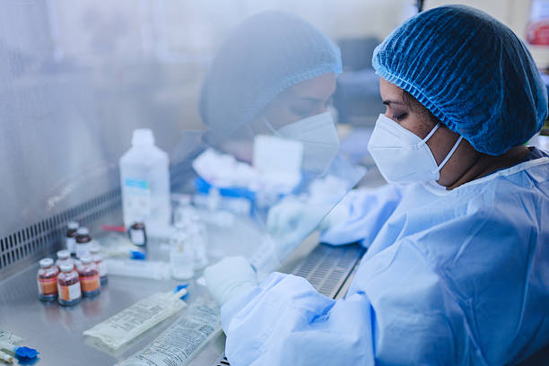 Pharmacist Preparing Medicinal Mixtures in a Sterile Environment