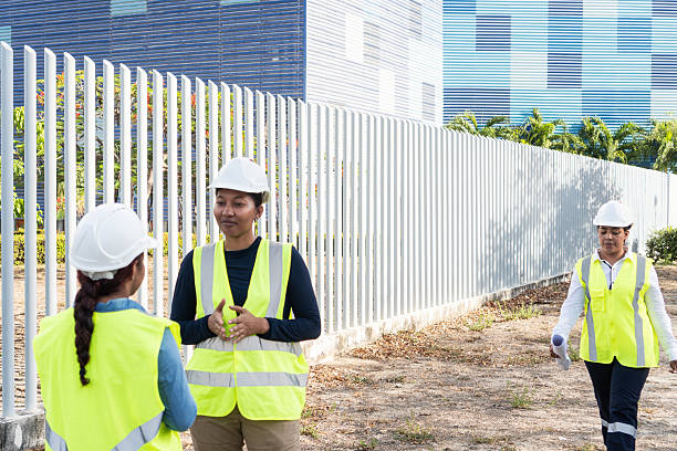 istock Female engineers discussing a project near a construction site 2216056418
