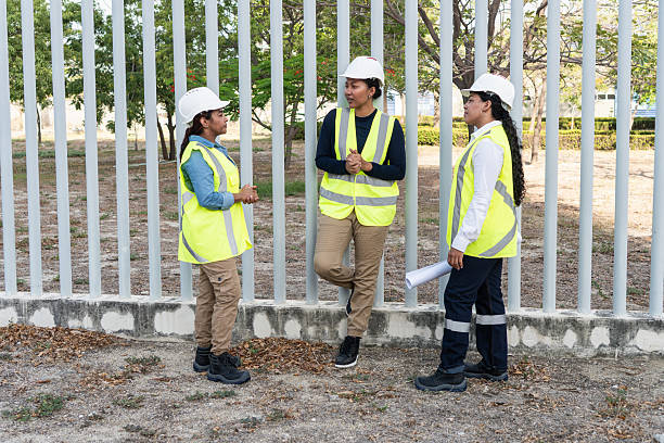 istock Female engineers discussing a project leaning on a metal fence 2216056516