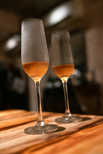 istock Chilled Champagne Glasses on Wooden Table – Intimate Night Celebration 2216058127