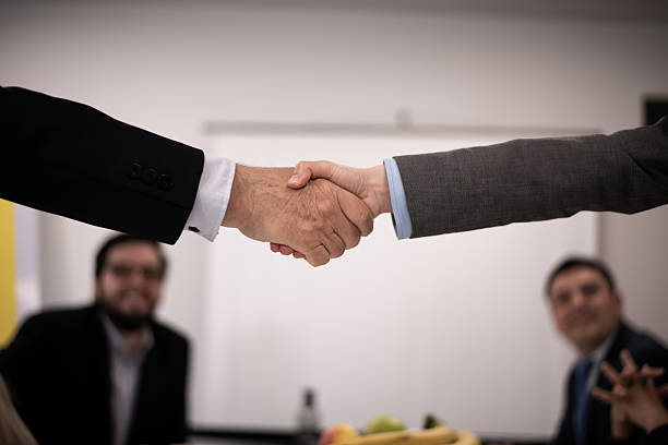 istock Professional handshake between colleagues in a business meeting setting 2216058523