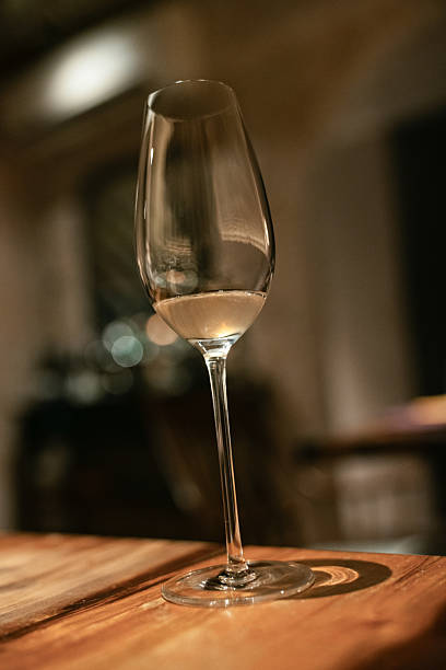 istock Champagne Glasses on Wooden Table in Restaurant 2216058728