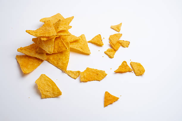 istock Crispy corn chips nachos tortilla on color background. Fast food. 2216062219