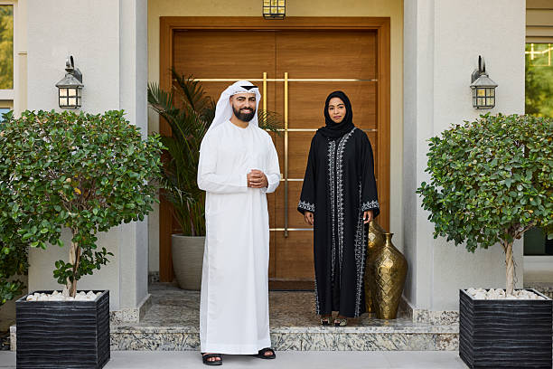istock Smiling Arab man standing with woman 2216062489