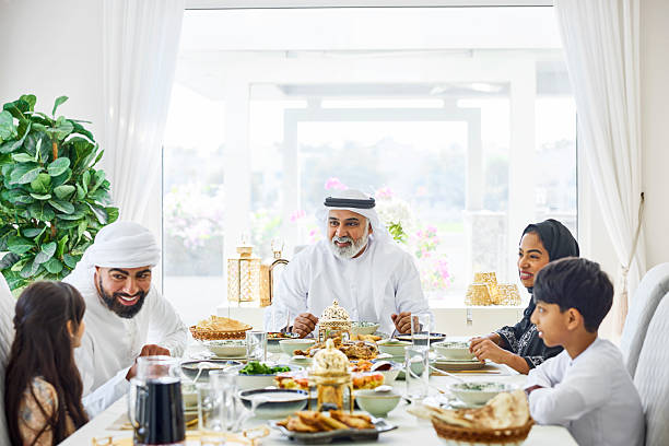 istock Emirati family having lunch while sitting at table 2216062612