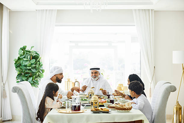 istock Happy middle eastern family having lunch at home 2216062708