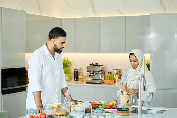istock Husband looking at wife grinding ingredient 2216062777