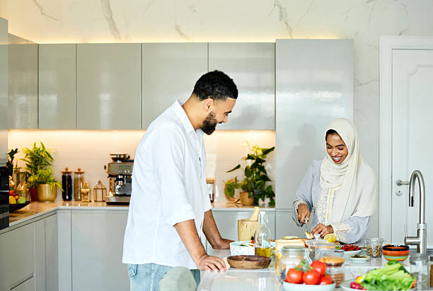 istock Middle eastern man with wife cutting vegetables 2216062779