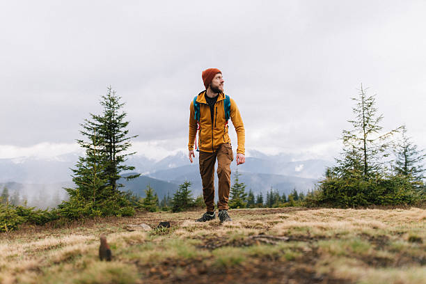 istock Man hiking in scenic mountain in spring 2216066119