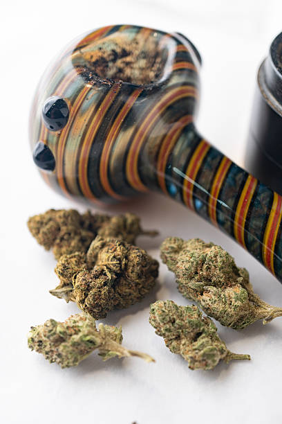 istock Marijuana Cannabis weed buds with pipe and grinder. 2216066193