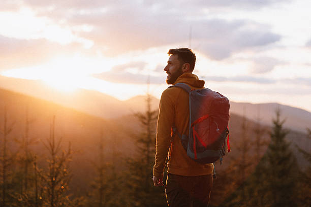 istock Man hiker at the sunset in the mountains 2216066332