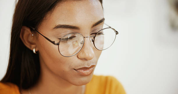 istock Home, reading and woman with glasses, decision and thoughtful with choice, solution and ideas. Person, copywriting and freelancer with eyewear, research for creative project and problem solving 2216066534