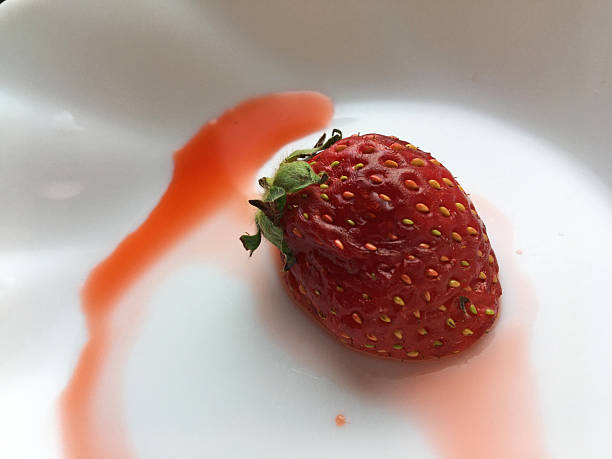 istock Sore and crushed strawberries 2216068686