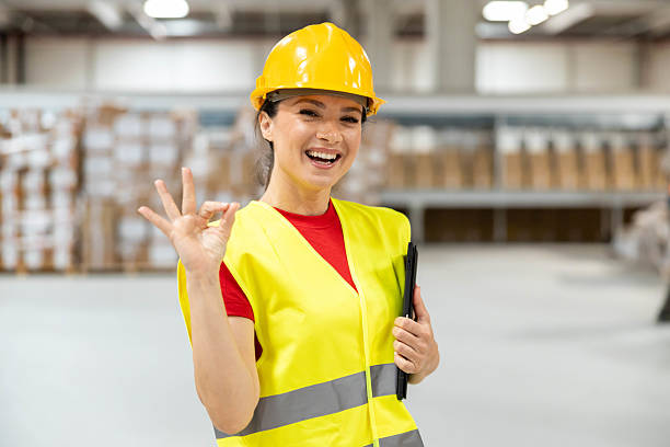 istock Female Warehouse Employee Giving OK Sign 2216068849