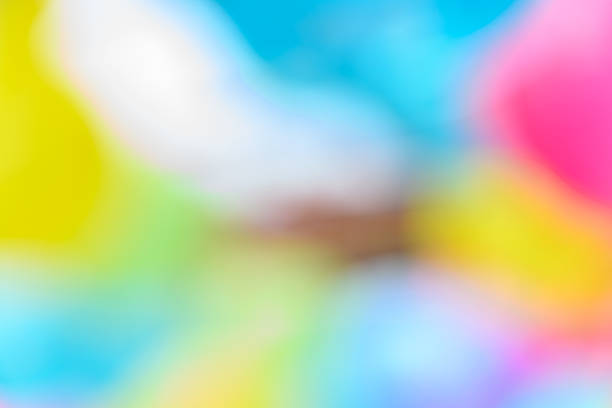 A gentle blend of bright pastel colors in an abstract blur that gives a light and cheerful feeling, perfect for creative design use.