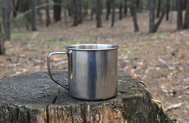 istock steel tourist mug on stump 2216074364