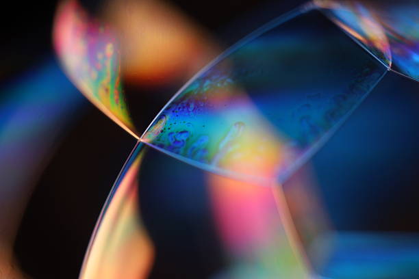 istock Green and blue reflections of liquid in macro, bright liquid surface, natural phenomena 2216075202