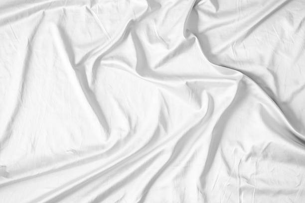 istock Abstract white wrinkled bedding sheet fabric texture background 2216075323