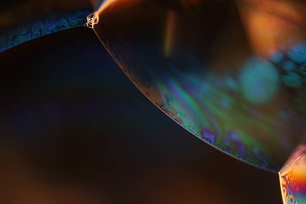 istock Green and blue reflections of liquid in macro, bright liquid surface, natural phenomena 2216075434
